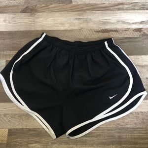 Black and white Nike running shorts.